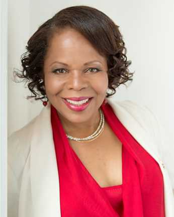 Professional headshot of a woman with confident expression, Janet Joyner Photography